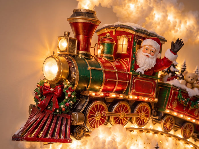 Close-up of the painted locomotive and the figures on the carriages